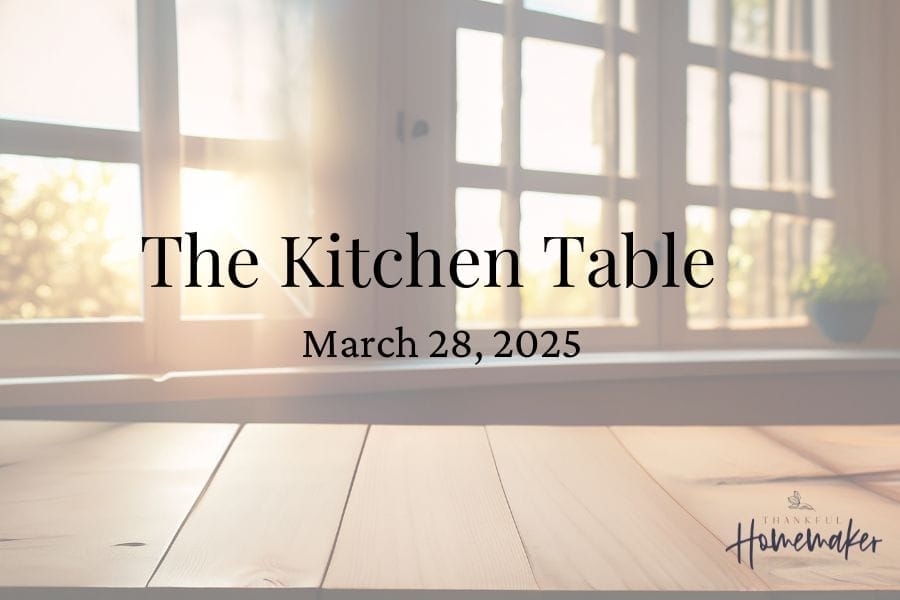Sunlight shining through a cozy kitchen window onto a wooden table, with the text ‘The Kitchen Table – March 28, 2025’ overlayed. Featured image for the Thankful Homemaker blog series.
