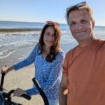 Married couple enjoying intentional time together during a peaceful beach walk