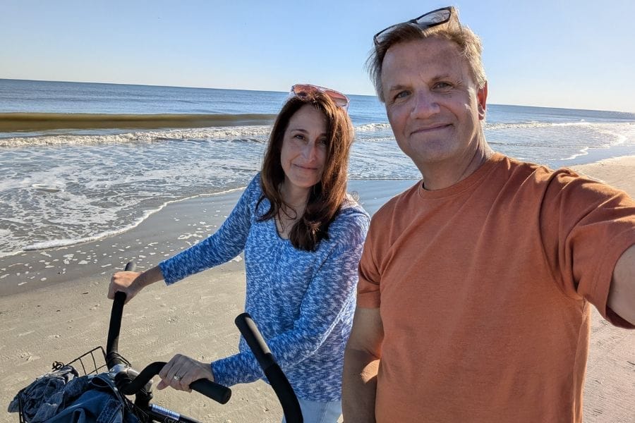Married couple enjoying intentional time together during a peaceful beach walk