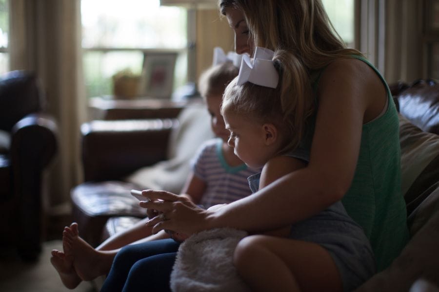 Mother comforting her young children during an unexpected moment at home—reminding us that daily interruptions can be God-appointed opportunities for love and obedience.