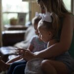 Mother comforting her young children during an unexpected moment at home—reminding us that daily interruptions can be God-appointed opportunities for love and obedience.