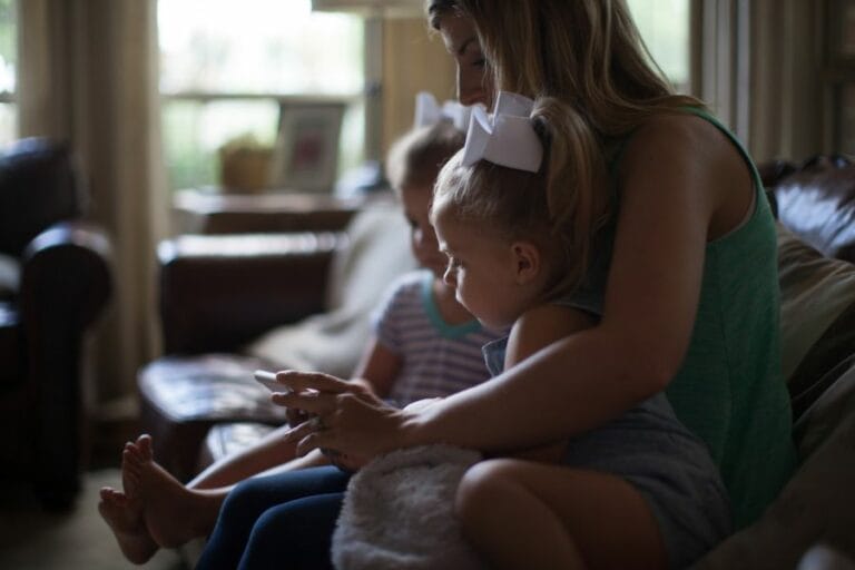 Mother comforting her young children during an unexpected moment at home—reminding us that daily interruptions can be God-appointed opportunities for love and obedience.